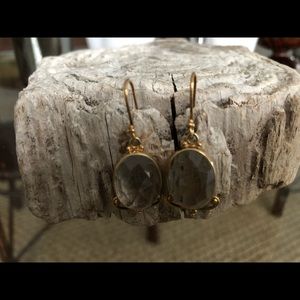 Faceted clear quartz in gold plated drop setting